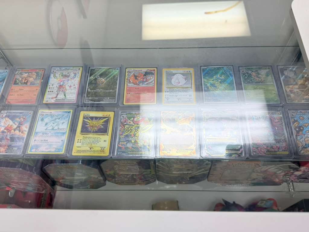 Graded and vintage Pokémon cards in the display case