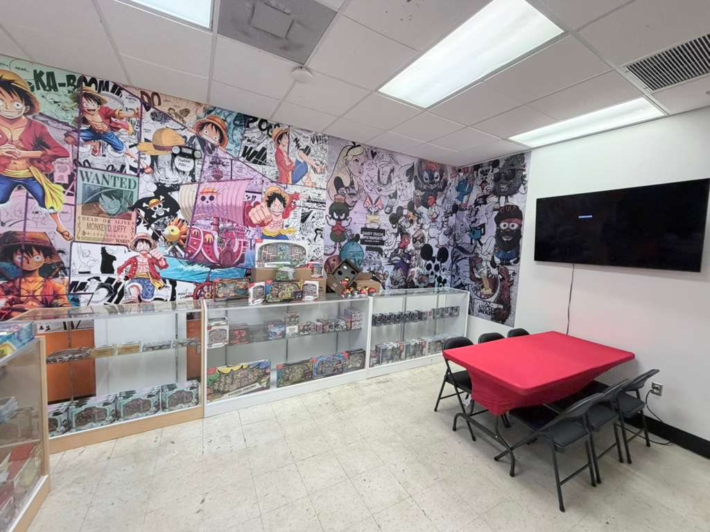 Seating area next to the display cases and One Piece mural