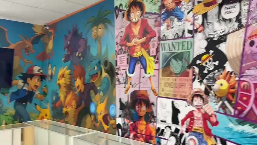 One Piece Luffy mural in the Unsealed & Delivered Co. back room