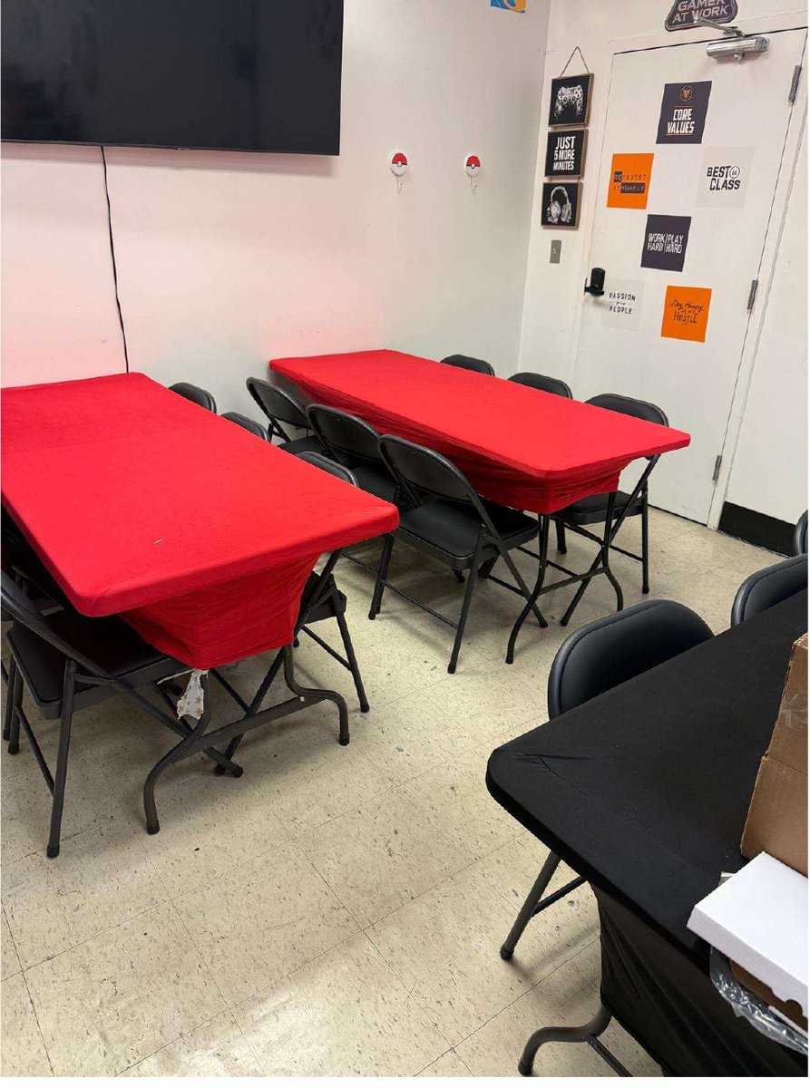 Dedicated play space at Unsealed & Delivered Co. with tables and chairs set up for organized TCG play