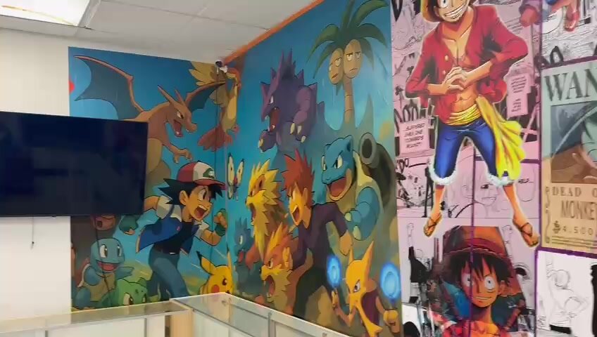Pokémon anime mural in the Unsealed & Delivered Co. back room