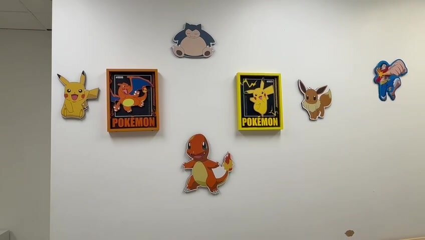 Pikachu, Charizard, Eevee, and Snorlax wall art display